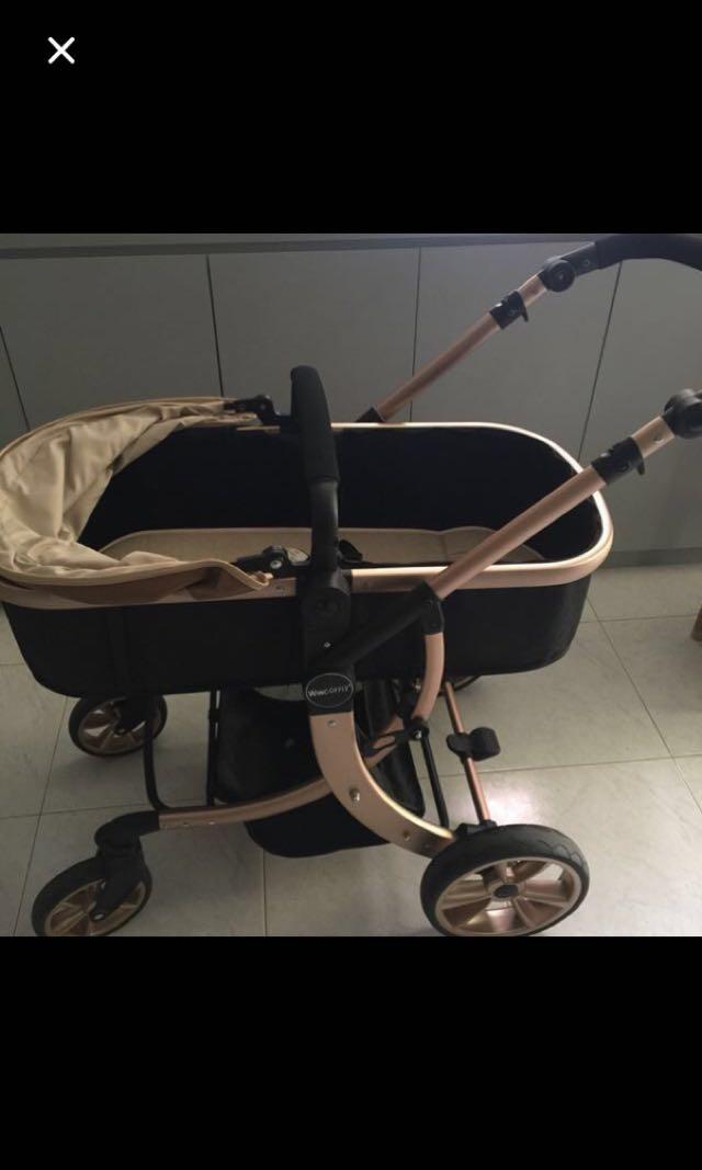 newborn in pram bassinet