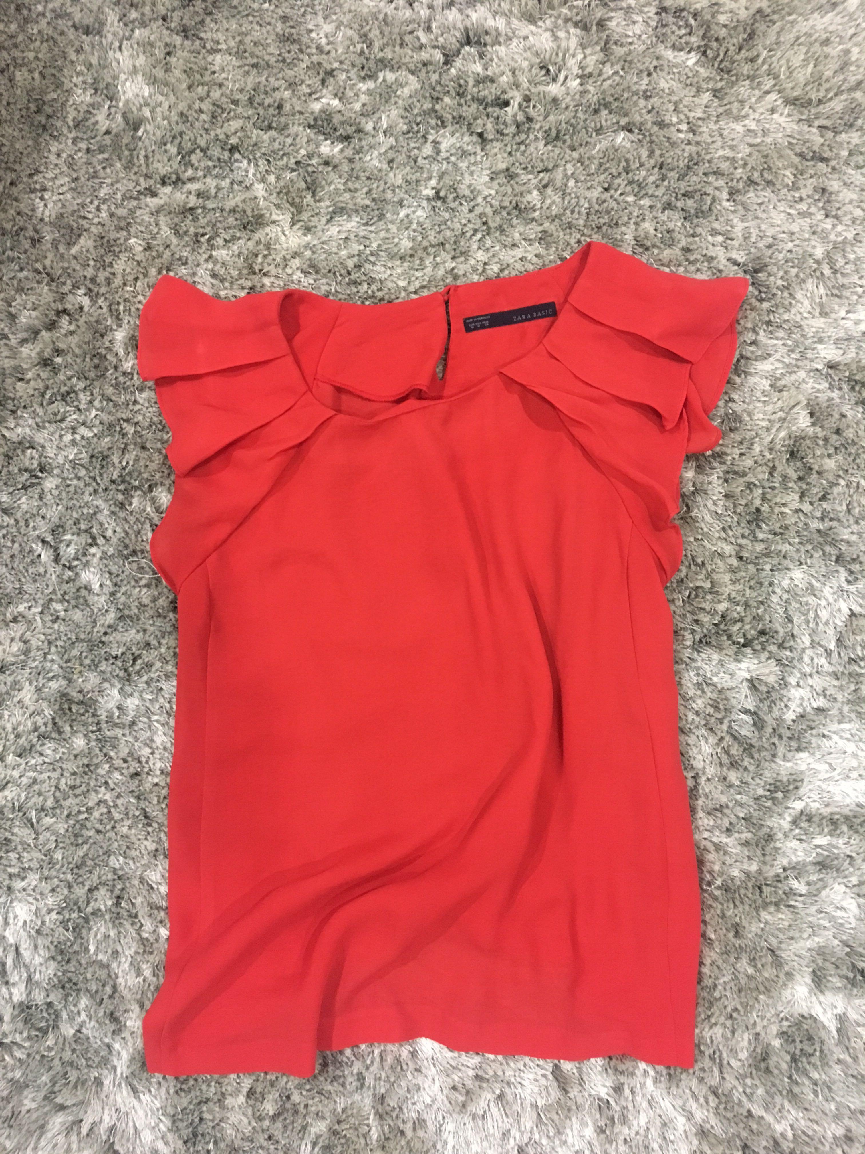 red blouse with ruffle sleeves