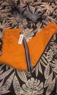 orange/yellow sweatpants size m