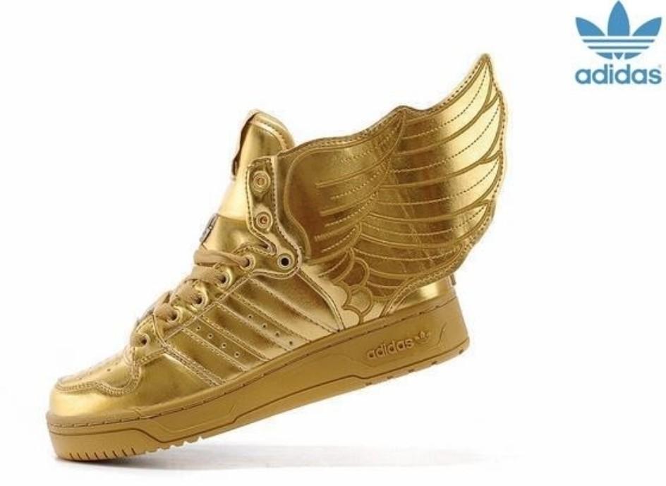 gold sneakers with wings
