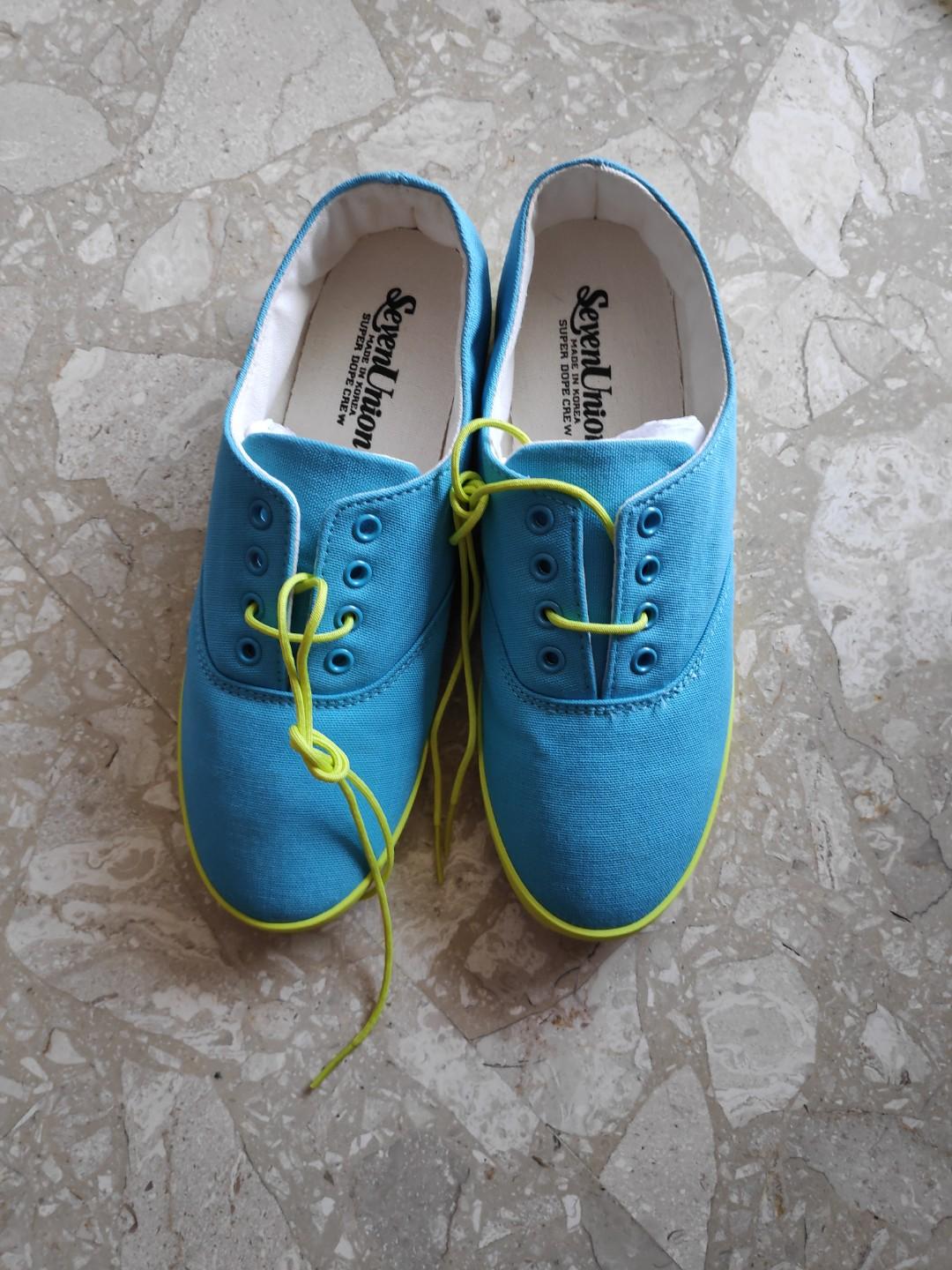 lime green and blue sneakers