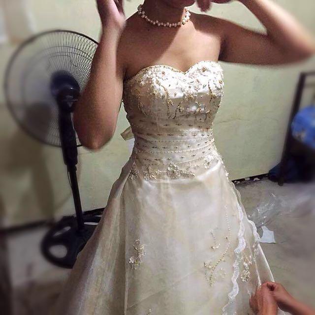 Wedding Gown For Sale (Category: Evening dresses & gowns) located in Manila. Submitted by anjsumalabe (Listing ID 124841381, Image 2). Description: Selling wedding gown. Used once on 2015. Champagne color. For more photos just message me. Ideal for 5'2 - 5'3, Bust size for 34B up - waist 28"-30". Combination of zip and lace up back closure. Can be worn with or without the shawl. RFS: declutter .