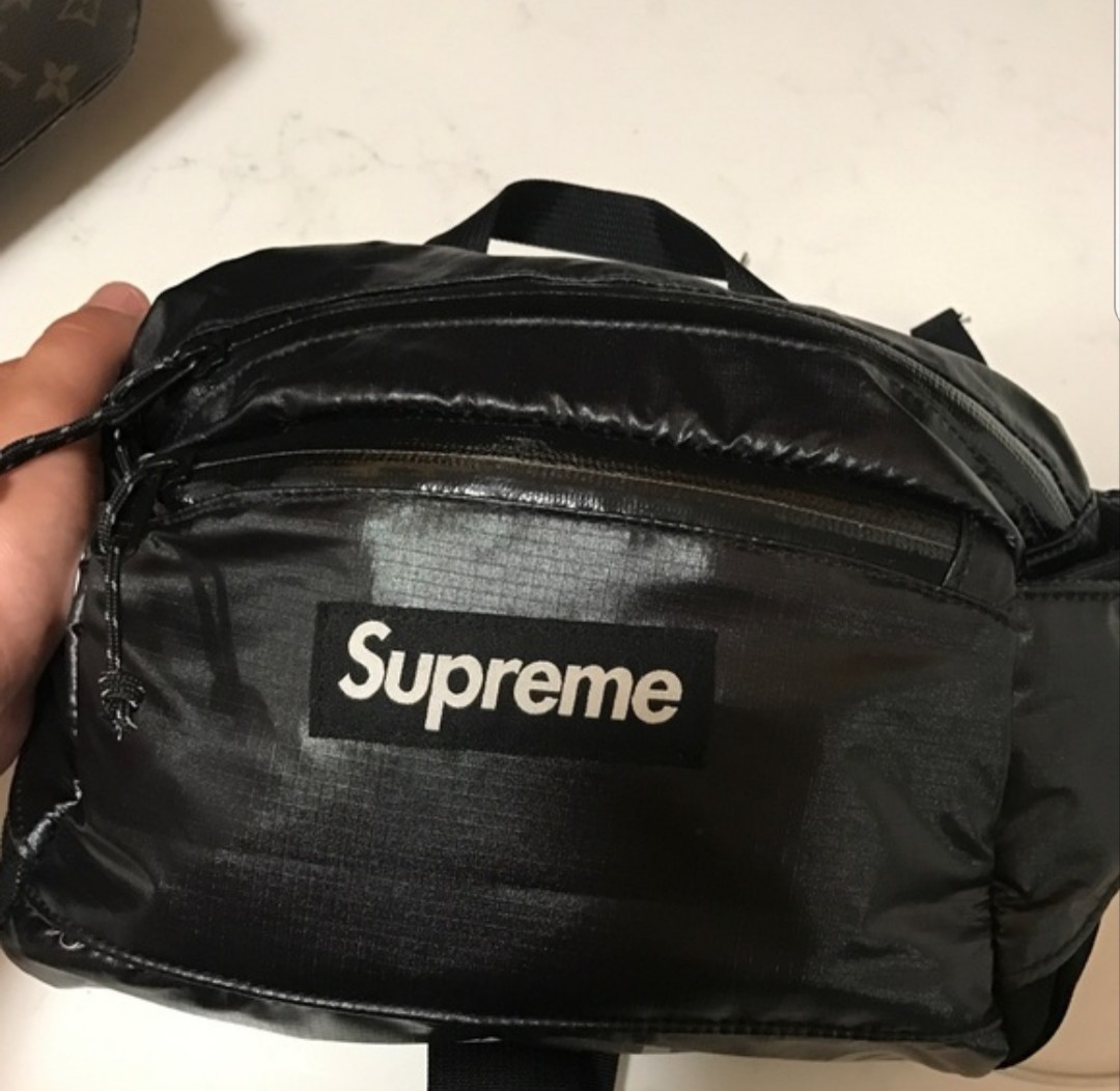 supreme kaws tee