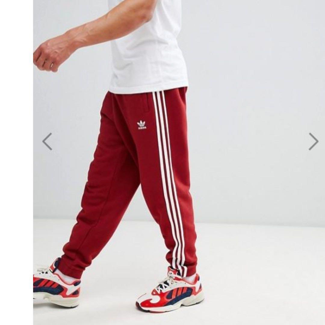 adidas originals adicolor three stripe track pants in red