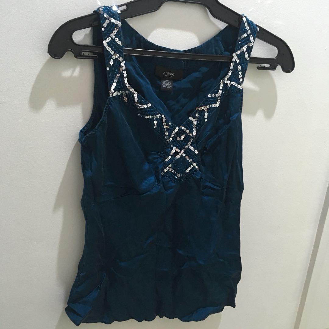 Sleeveless Silk Top (Category: Sleeveless) located in Quezon City. Submitted by everythingnewph (Listing ID 208562526, Image 1). Description: NO FLAWS! Good as new! RFS: Decluttering It can fit to S-L frames My current size is Large, it still fits me! 😄.