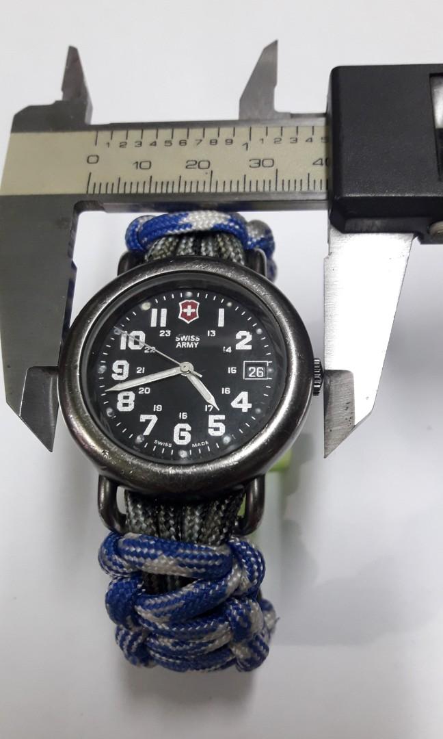 SWISS ARMY WATCH (Category: Men's Watches) located in Manila. Submitted by thegreat. (Listing ID 150208726, Image 1). Description: Authentic Original Vintage classic look sign of usage stain on dial but not so noticeable Good running condition Swiss made Paracord strap Wrist size. 18 cm.