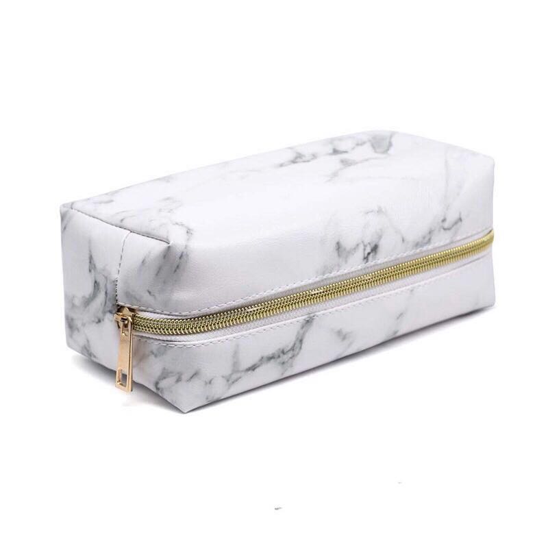 white and gold pencil case