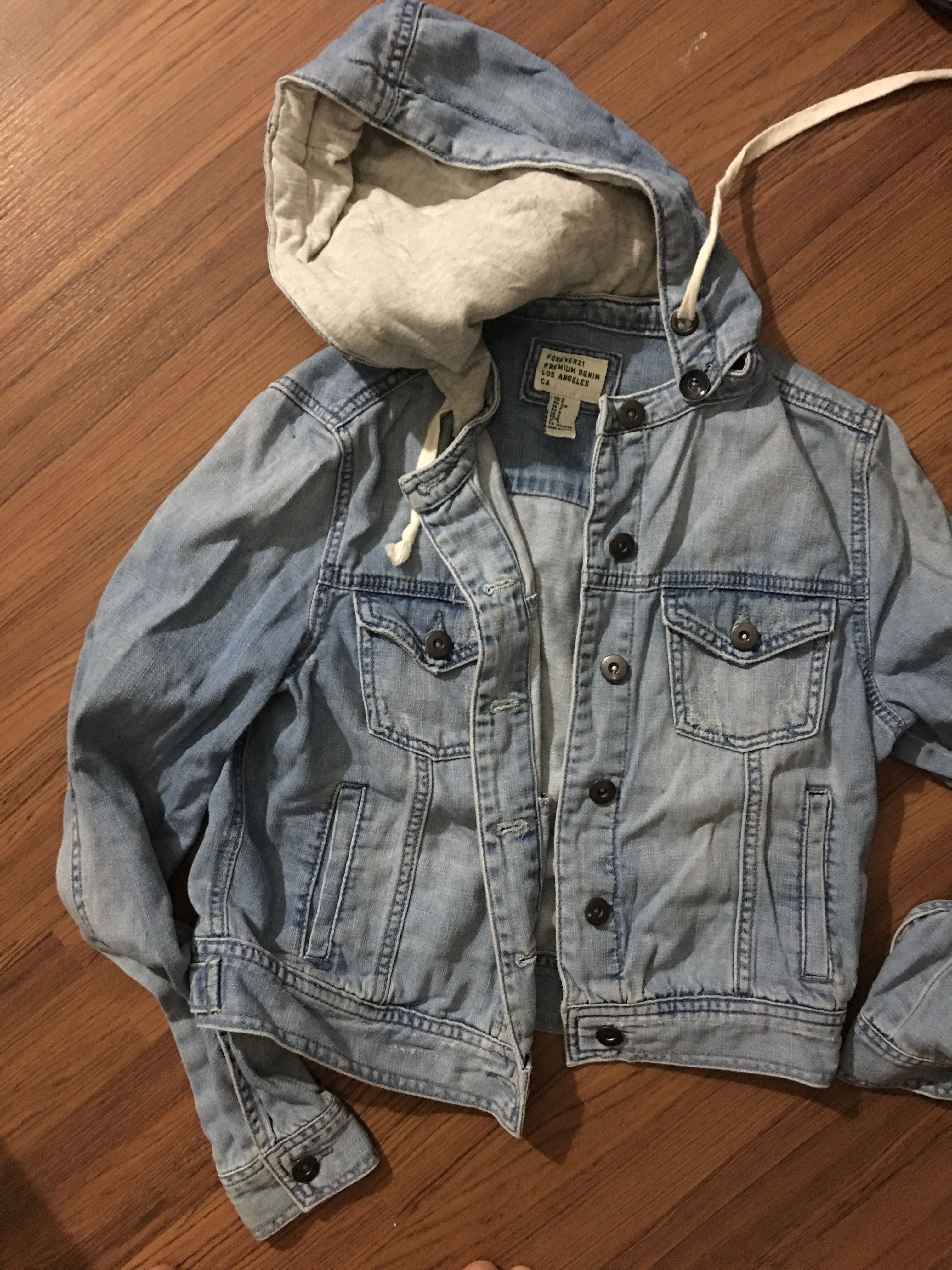 jean jacket with gray hood