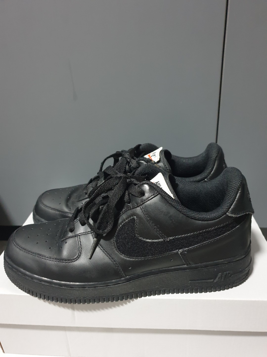 air force ones with black swoosh