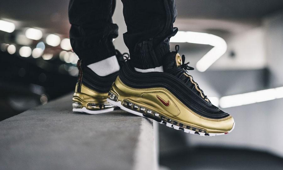 Gold and black air max 97