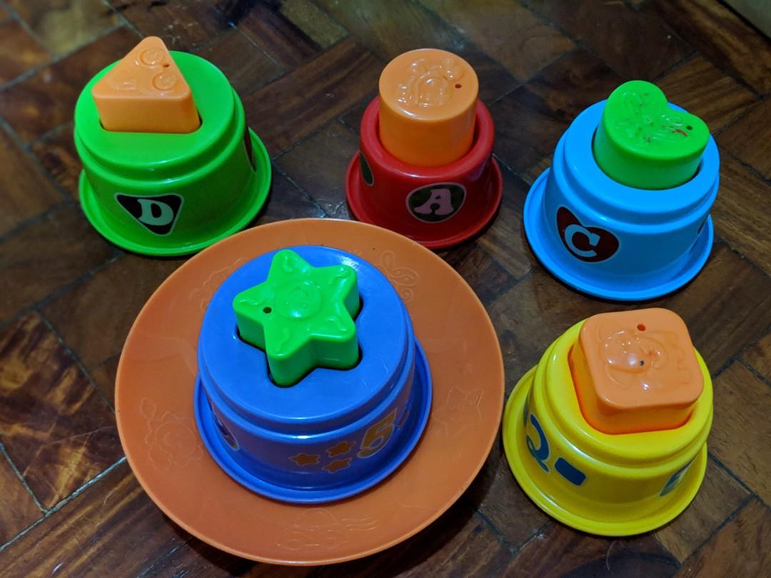 Stacking toy (Category: Infant Playtime) located in Makati City. Submitted by shruti11s (Listing ID 209368389, Image 1). Description: Pre loved stacking cup Educational toy.