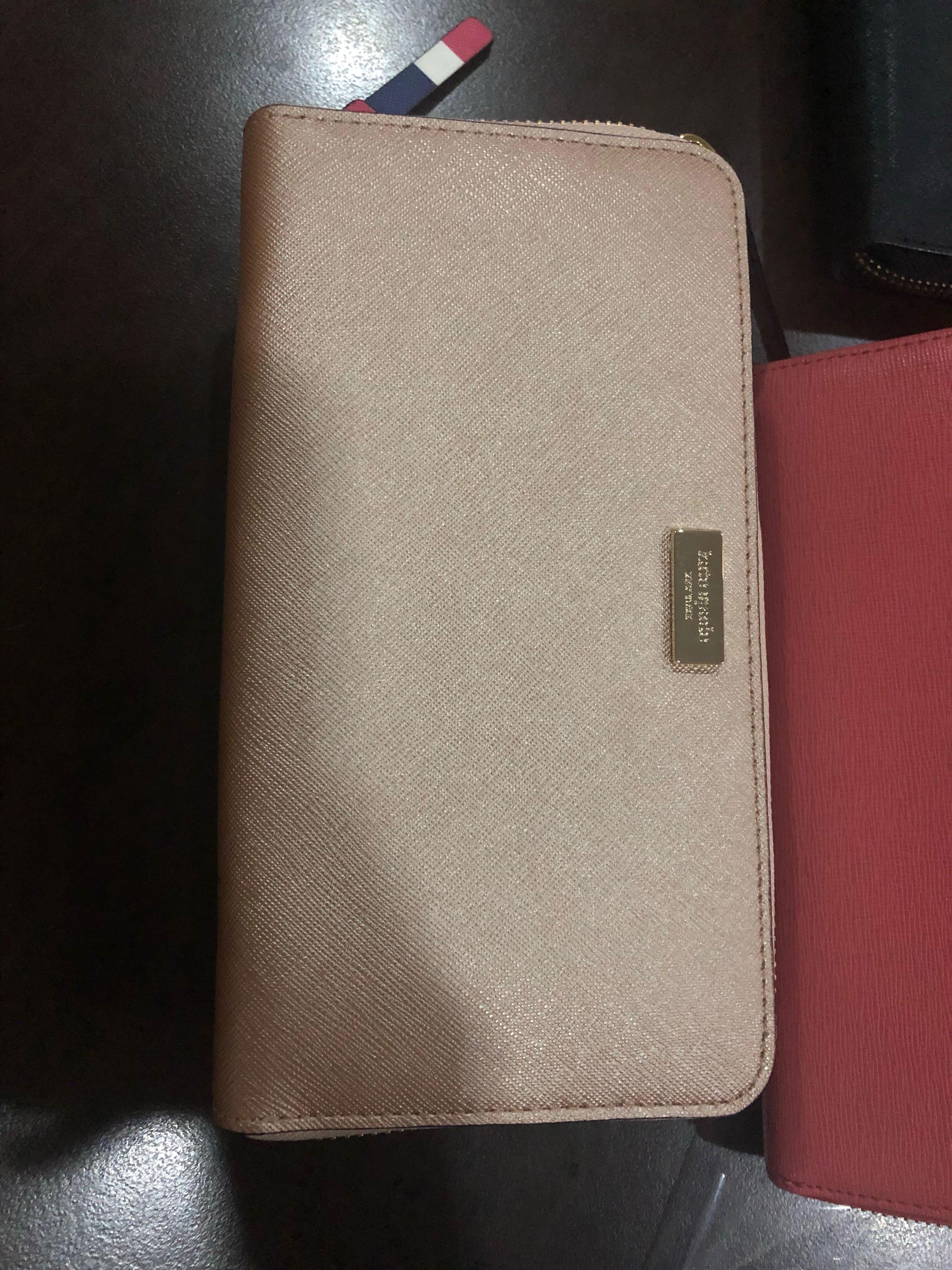 Metallic rose gold kate spade wallet (Category: Wallets & Card holders) located in Quezon City. Submitted by bealee (Listing ID 209778974, Image 1). Description: Still with tags.