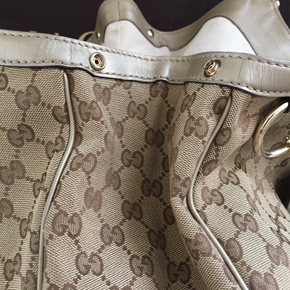GUCCI Monogram Large Sukey Tote Champagne (Category: Luxury Bags & Wallets) located in Paranaque City. Submitted by marshy (Listing ID 200551565, Image 3). Description: • Preloved Gucci Sukey Large Tote, in very good condition overall. Slight signs of wear but not obvious. Please refer to photos for specifics - 1 minor popped stitch on the back part, surface wear on handles and marks on interior. • Inclusions: Cards, swatch, dust bag • Purchased: