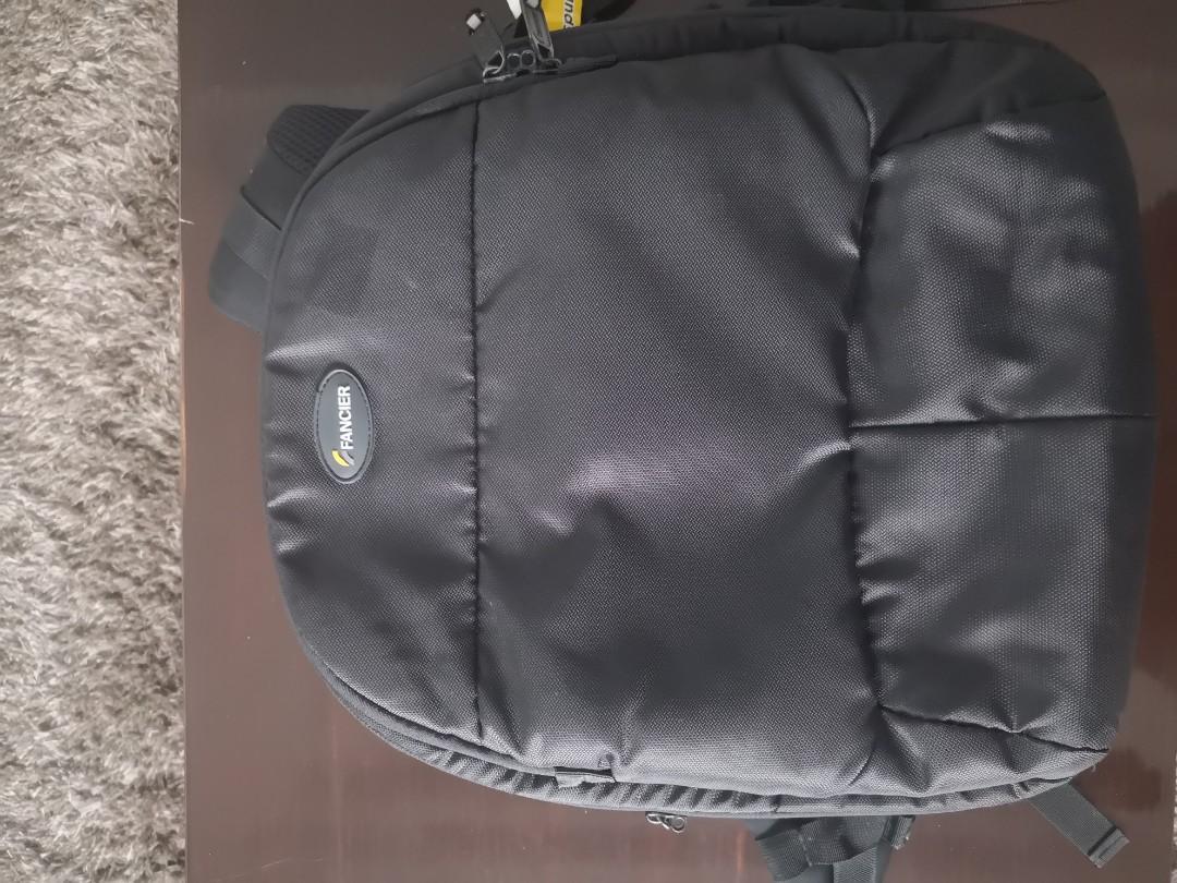 Fancier Camera Backpack (Category: Camera Bags & Carriers) located in Pasig City. Submitted by rbejasa (Listing ID 210234716, Image 1). Description: - Slightly used - Perfect for carrying your DSLR camera equipment - includes laptop compartment - includes raincoat to protect your gear against harsh weather conditions.