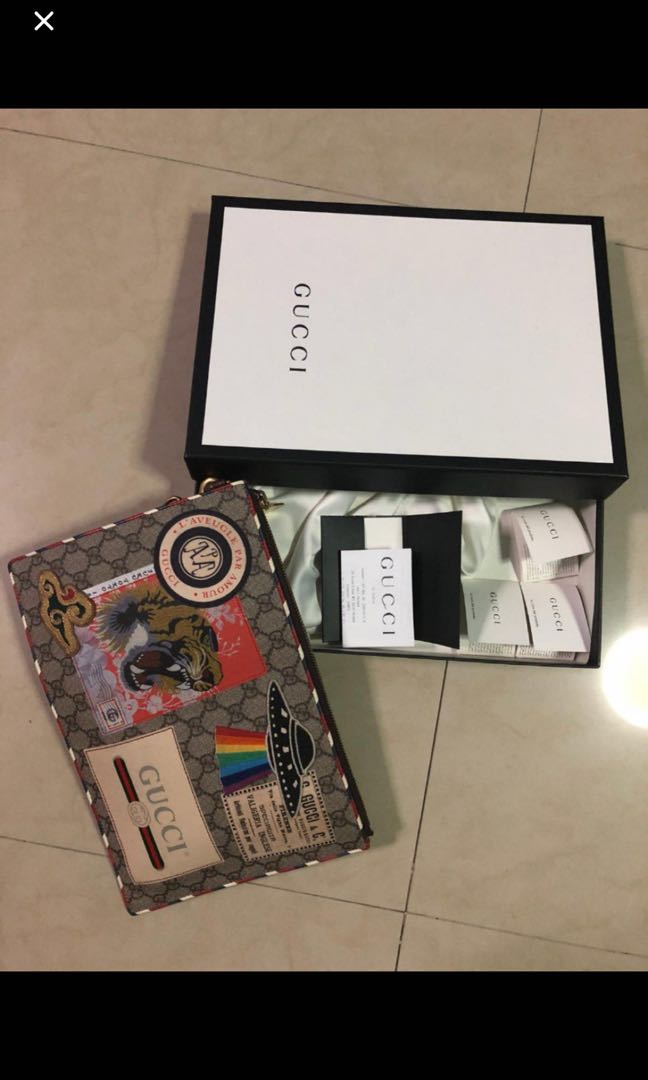 gucci supreme clutch