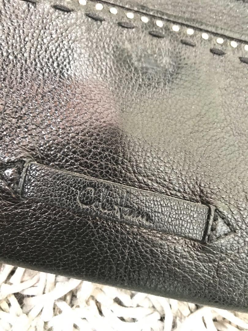 Cole Haan shoulder bag (Category: Shoulder Bags) located in Manila. Submitted by jenosaur (Listing ID 208465307, Image 2). Description: • Cole Haan shoulder bag with chain strap • Has magnetic snap in front and back pockets • Has an inner zip pocket • Has a small key holder inside as shown in the picture.