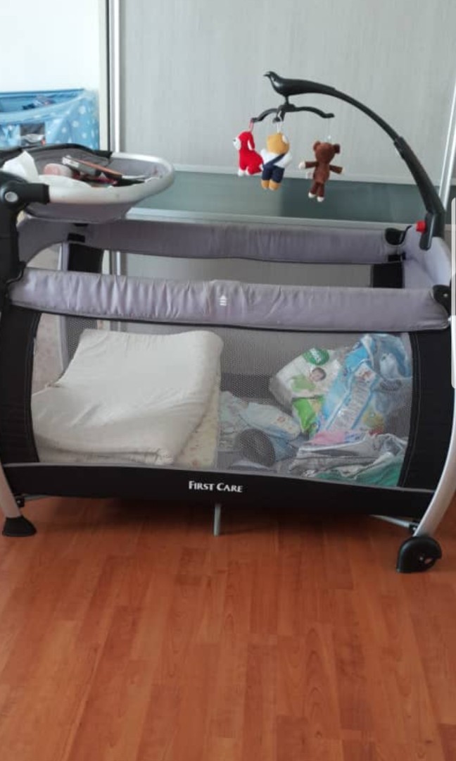 Baby cot first care playpen adjustable free bed sheet