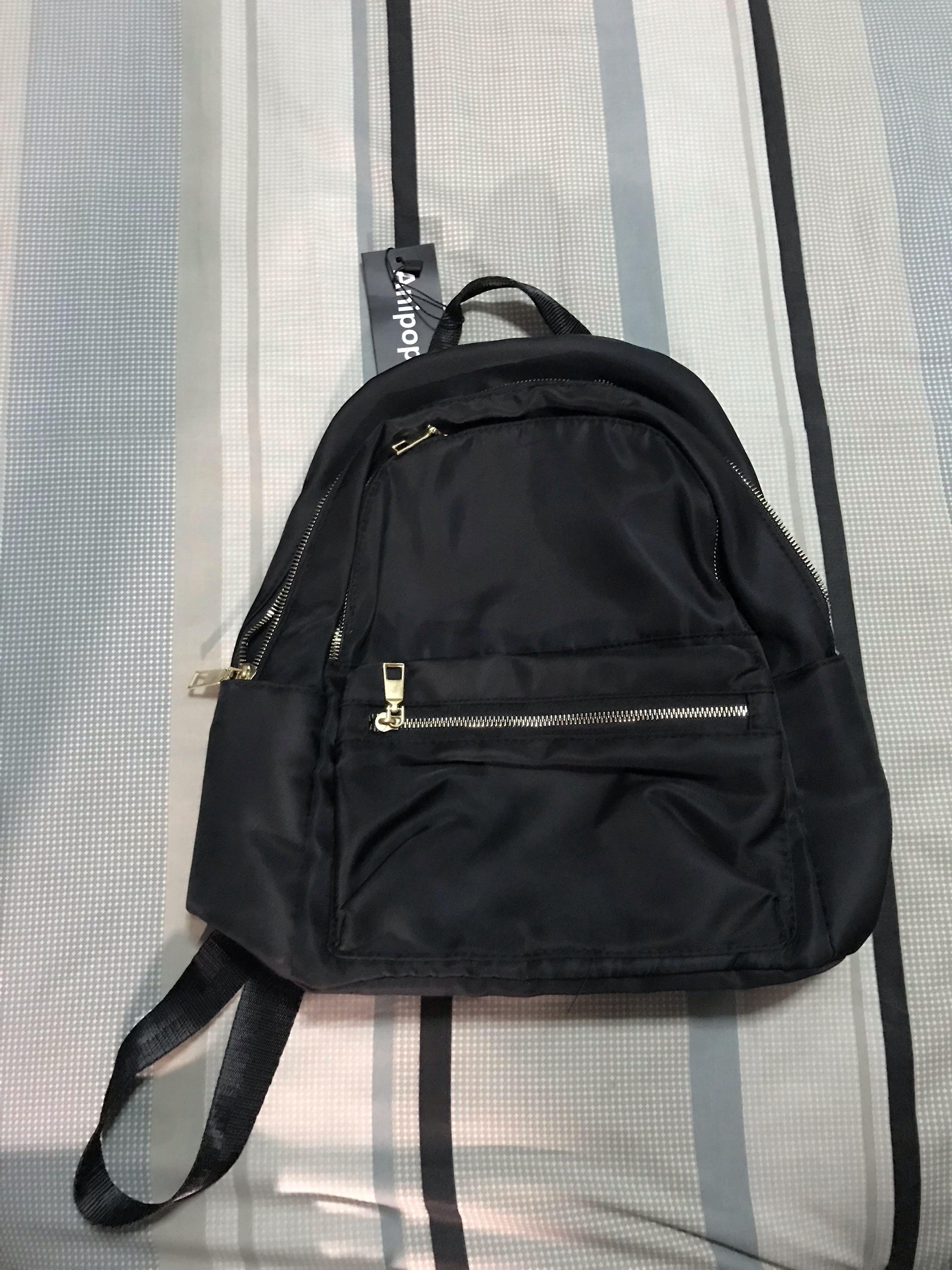 Black backpack with gold 2025 zippers