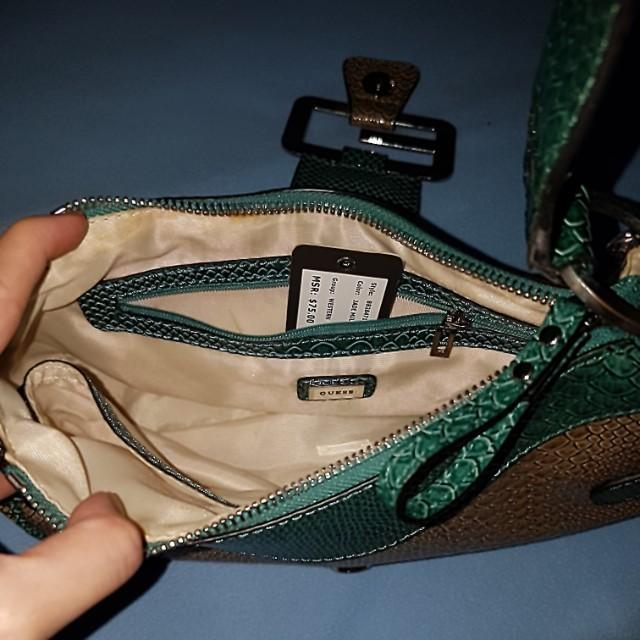 Guess Croc-Skin Bag (Category: Cross-body Bags) located in Paranaque City. Submitted by mamaalphaecho (Listing ID 211324492, Image 2). Description: FIXED PRICE = READ THE ENTIRE AD PRIOR TO INQUIRY. Click "READ MORE" = Used once then stored. EUC. Hardware just needs polishing. Color: Jade Multi Material: Faux croc skin Purchased in the US. This is a used item so please manage your expectations. Price is FIRM. Lowballers will not be entertained. P