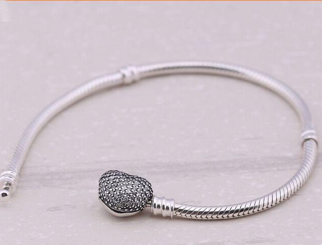 Pandora silver bracelet with heart-shaped clasp (Category: Bracelets) located in Quezon City. Submitted by _4everlove (Listing ID 211045990, Image 1). Description: Pandora silver bracelet with heart-shaped clasp 19 cm Comes with pouch only.
