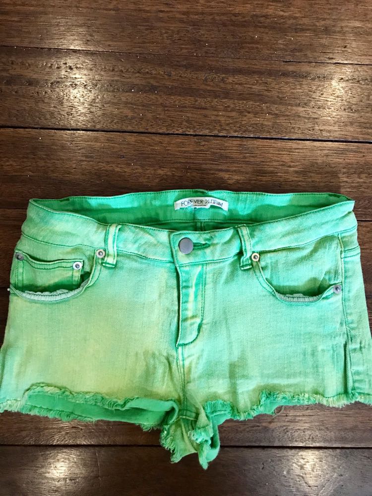 green denim shorts