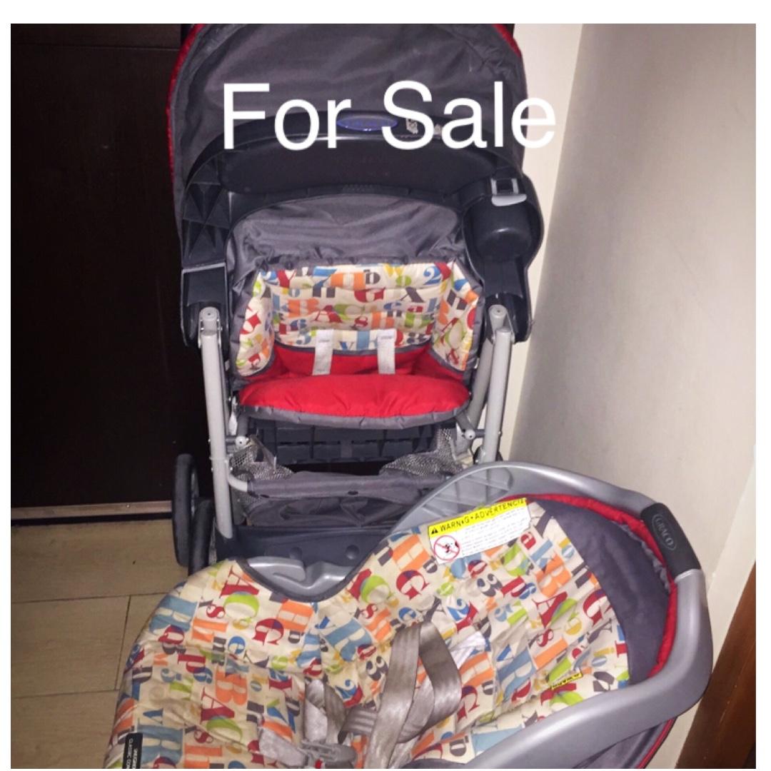 red stroller with car seat