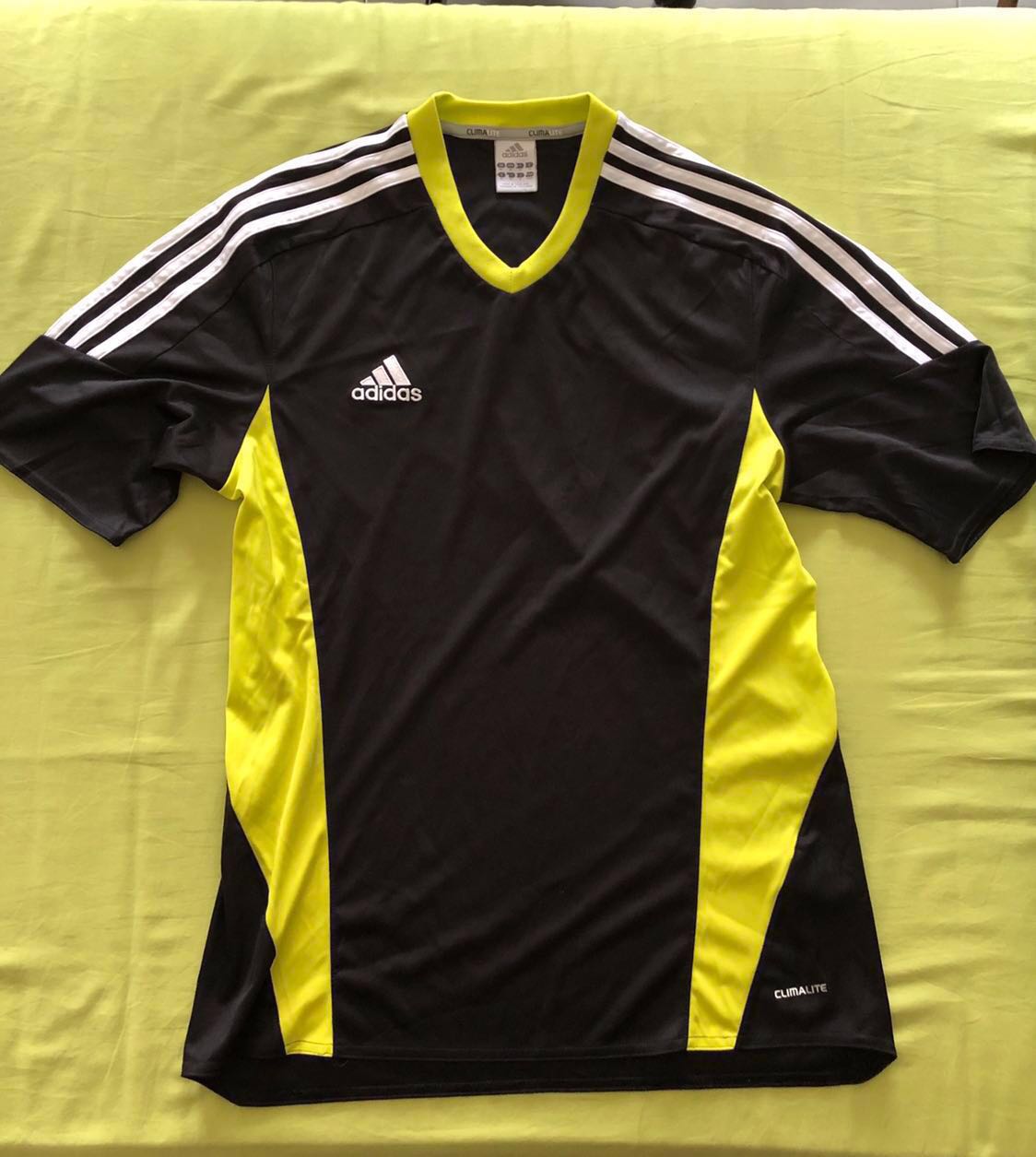 black and yellow adidas shirt