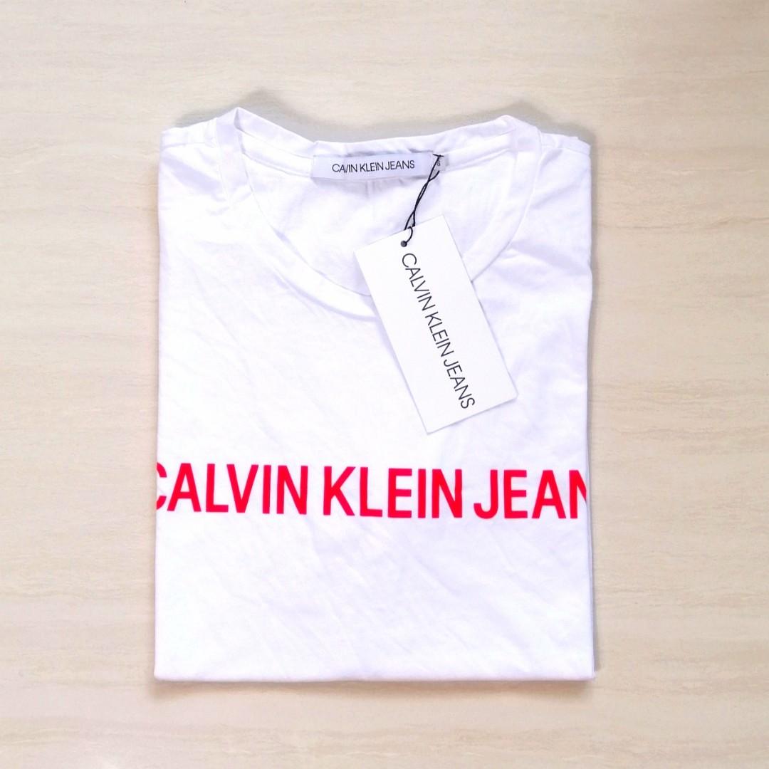 white shirt with red logo