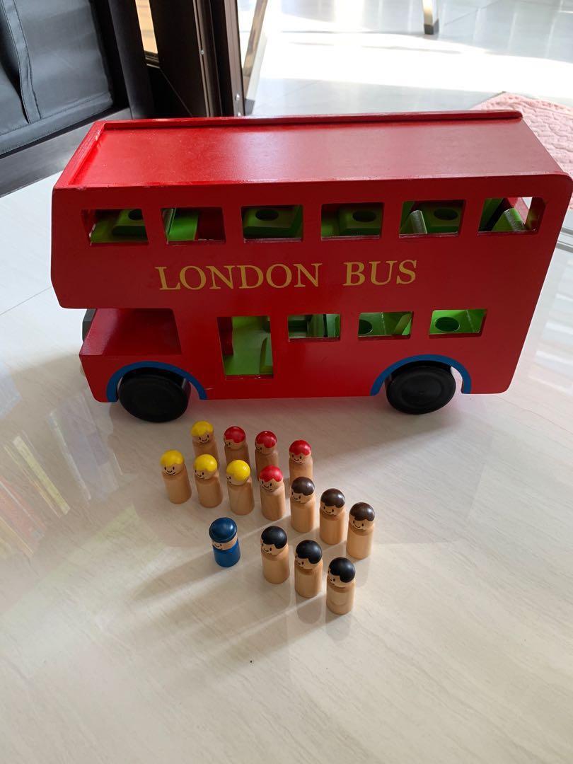 wooden london bus with passengers