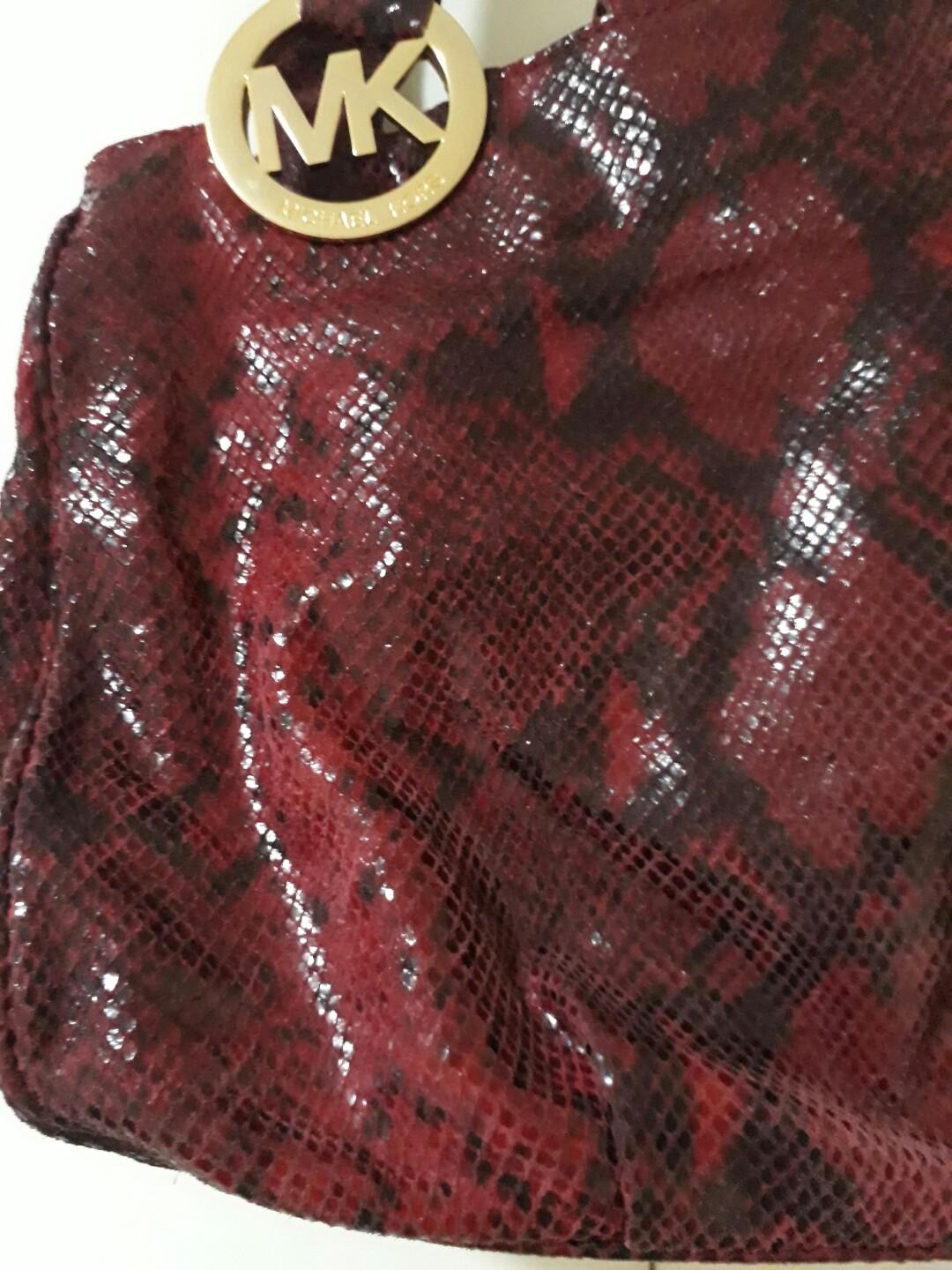 Michael Kors Bag (Category: Luxury Bags & Wallets) located in Paranaque City. Submitted by modarkm (Listing ID 212242165, Image 2). Description: Authetic Michael Kors bag bought in US. Snake skin material- red and black combination. Still in good condition just some minor dirt inside the bag due to usage..