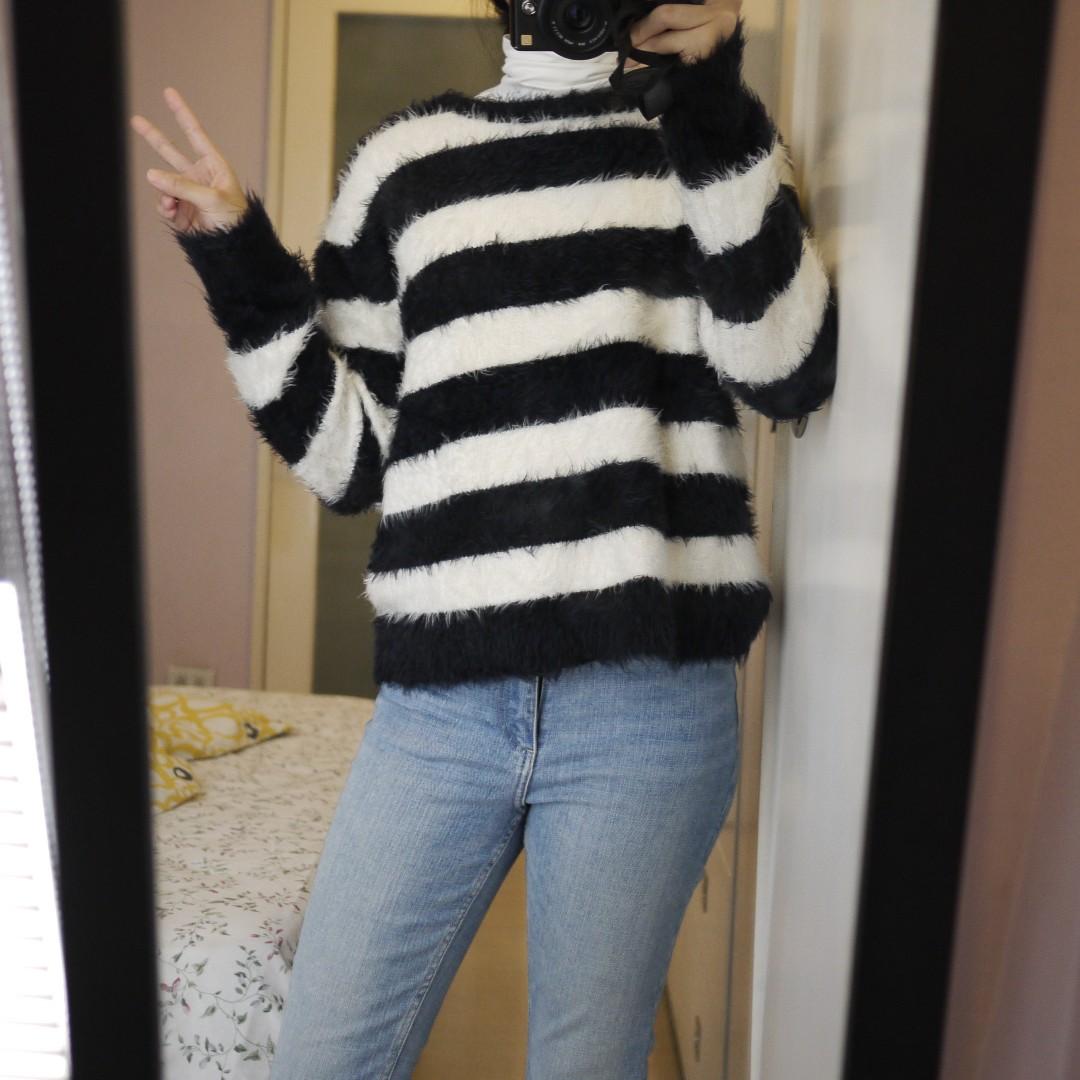 Black and shop white fuzzy sweater