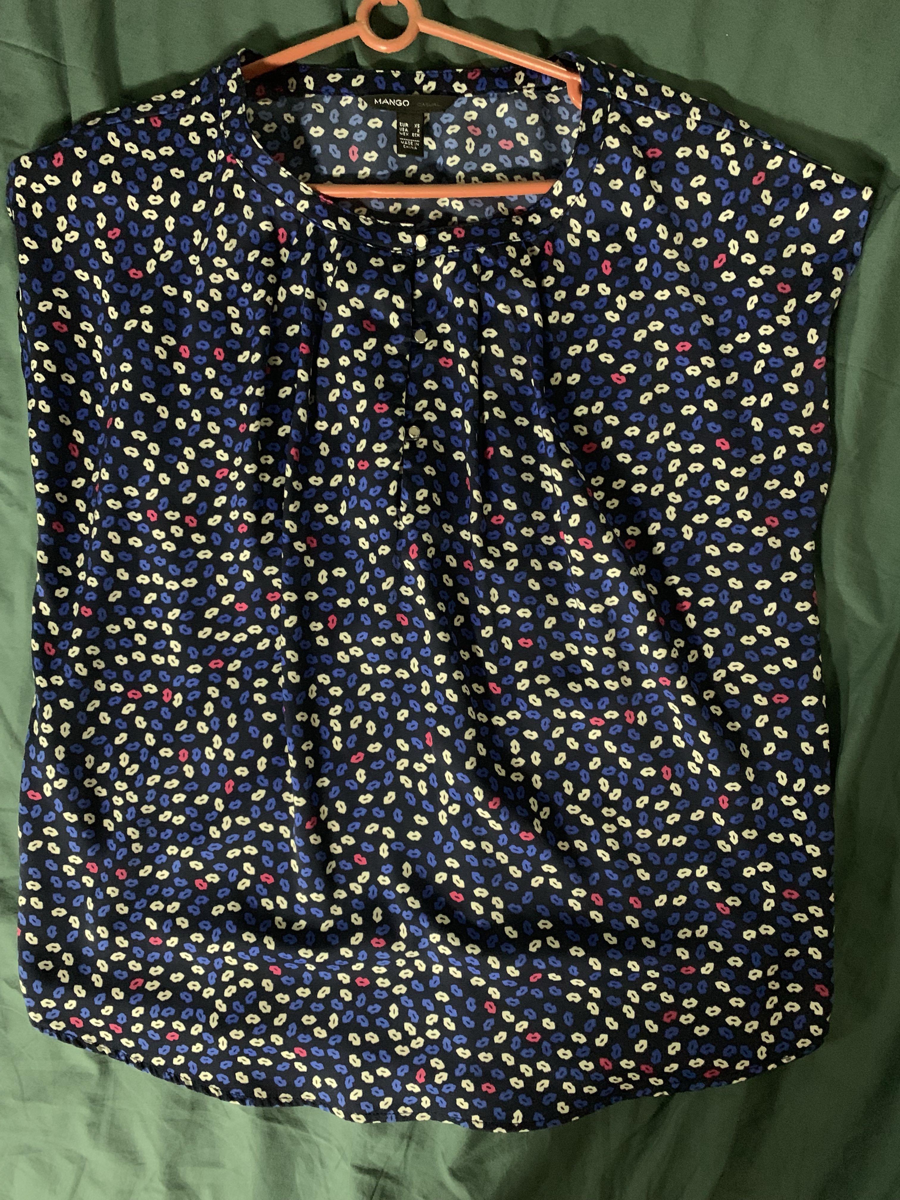 Kiss Me Mango Short Sleeve Blouse (Category: Blouses) located in Quezon City. Submitted by isabelhdp (Listing ID 212772525, Image 1). Description: Blue short-sleeved blouse with buttons in good condition and in need of a new parent to take good care of me. Buyer to pay for shipping fee (Metro Manila only) (P60-99).