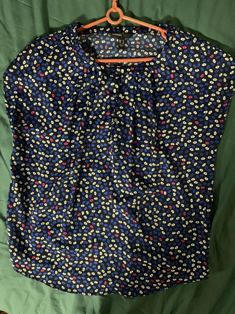 Kiss Me Mango Short Sleeve Blouse (Category: Blouses) located in Quezon City. Submitted by isabelhdp (Listing ID 212772525, Image 2). Description: Blue short-sleeved blouse with buttons in good condition and in need of a new parent to take good care of me. Buyer to pay for shipping fee (Metro Manila only) (P60-99).