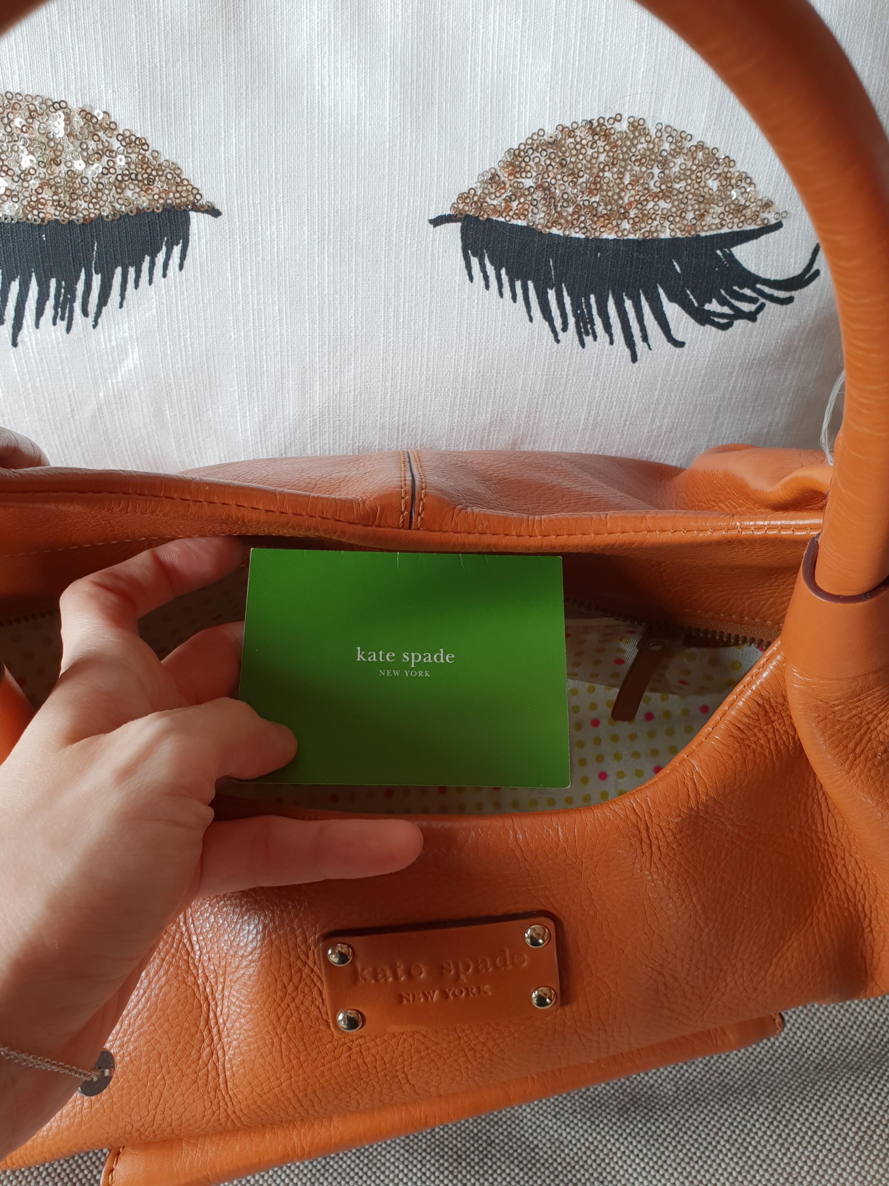 Kate Spade tan bag (Category: Luxury Bags & Wallets) located in Quezon City. Submitted by essinea (Listing ID 212997246, Image 2). Description: Kate Spade bag with cards and box.