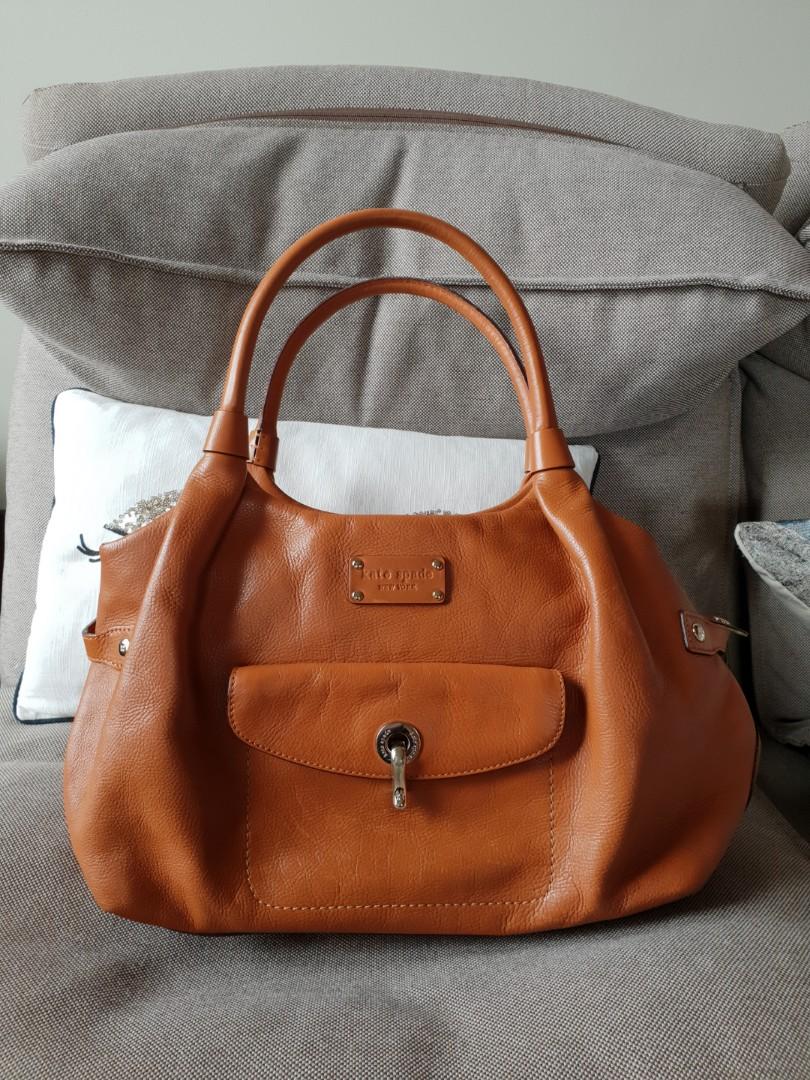 Kate Spade tan bag (Category: Luxury Bags & Wallets) located in Quezon City. Submitted by essinea (Listing ID 212997246, Image 1). Description: Kate Spade bag with cards and box.