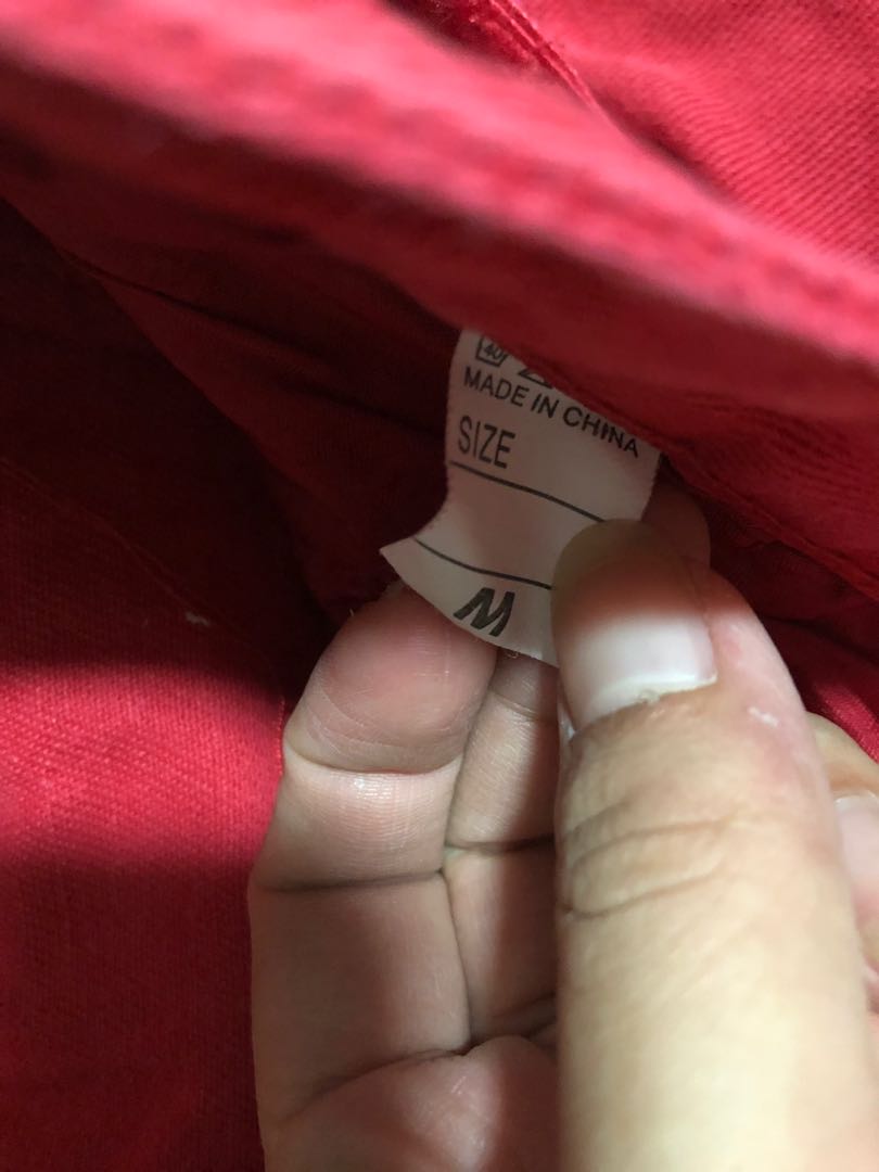 Red ripped shorts on sale
