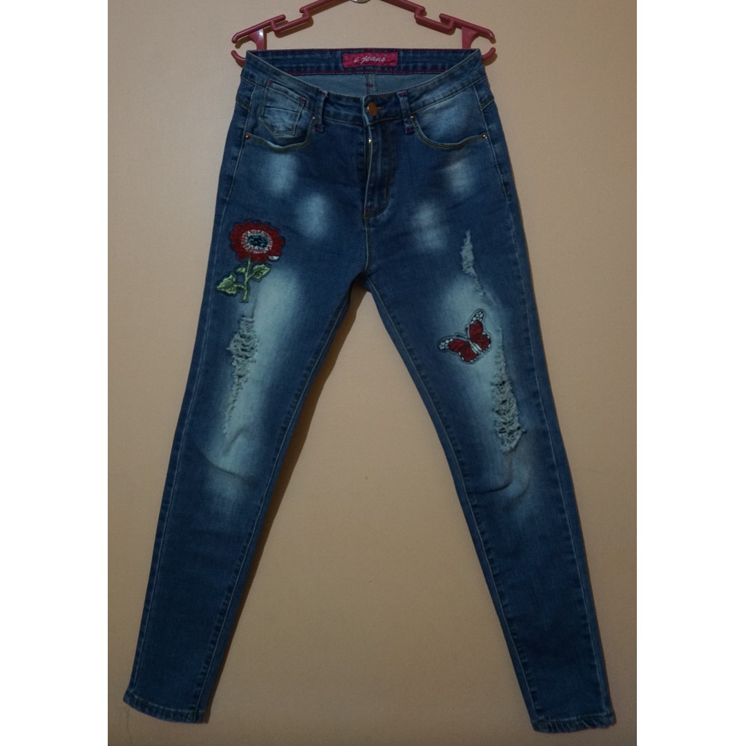 floral embroidered ripped design jeans