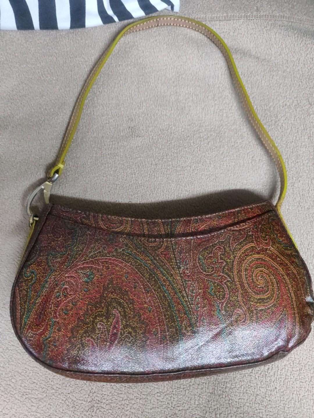 Re priced Etro pochette bag with serial (Category: Luxury Bags & Wallets) located in Mandaluyong City. Submitted by handbagprincess (Listing ID 213795566, Image 1). Description: No rubs or major flaws. Hardware mejo faded na. With two pockets outside the bag and one zip pocket inside. Signs of usage. Tags only: #GUCCI #Mk #katespade #fendi #prada #LouisVuitton #miumiu #tote #SHOES #chanel.