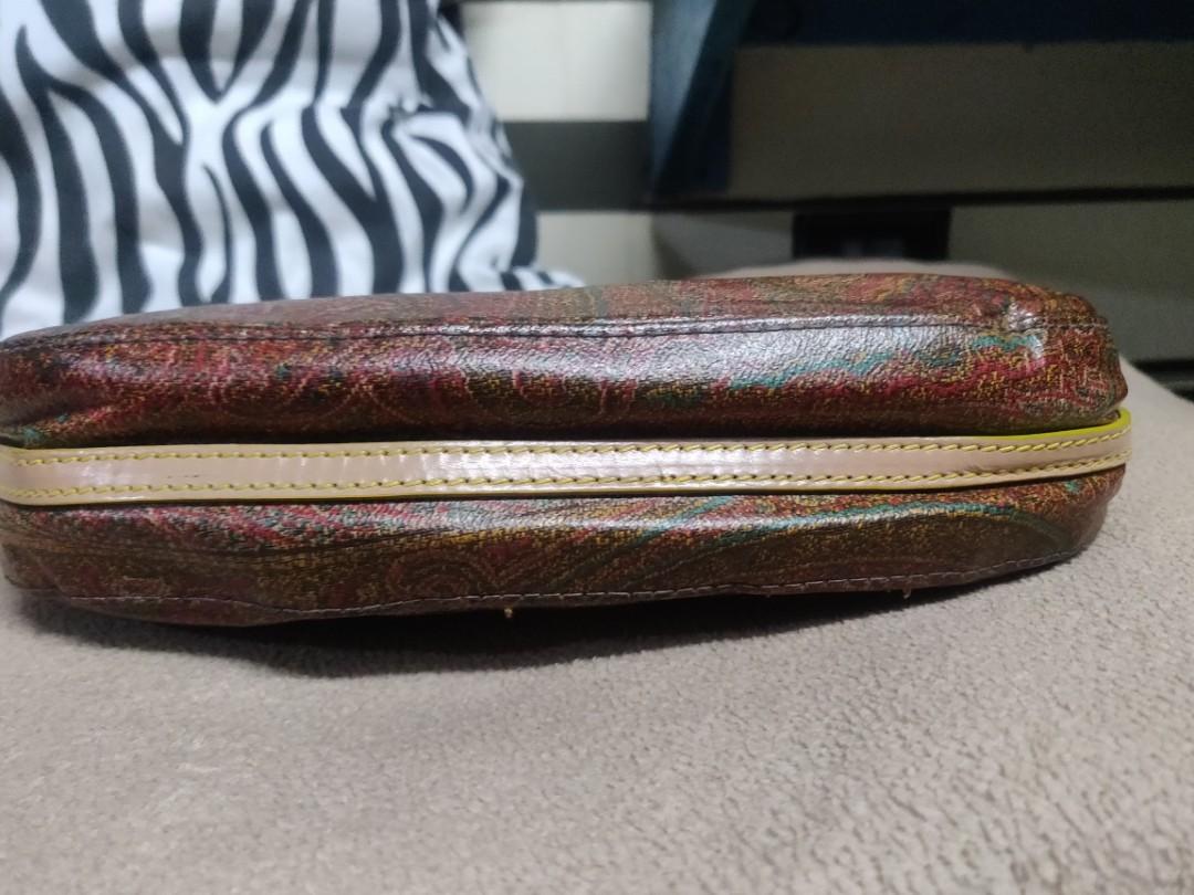 Re priced Etro pochette bag with serial (Category: Luxury Bags & Wallets) located in Mandaluyong City. Submitted by handbagprincess (Listing ID 213795566, Image 2). Description: No rubs or major flaws. Hardware mejo faded na. With two pockets outside the bag and one zip pocket inside. Signs of usage. Tags only: #GUCCI #Mk #katespade #fendi #prada #LouisVuitton #miumiu #tote #SHOES #chanel.