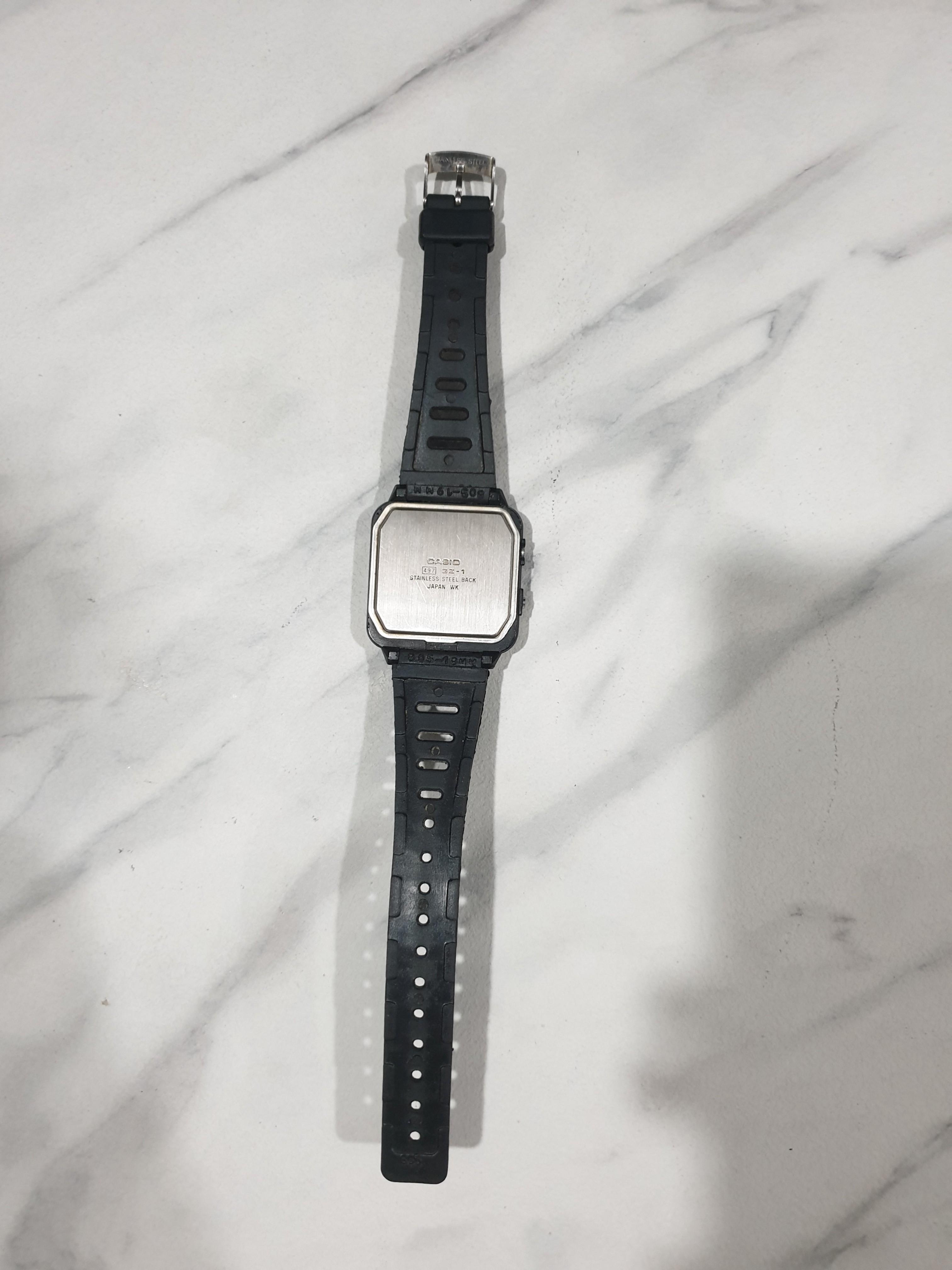 casio silver watch at game