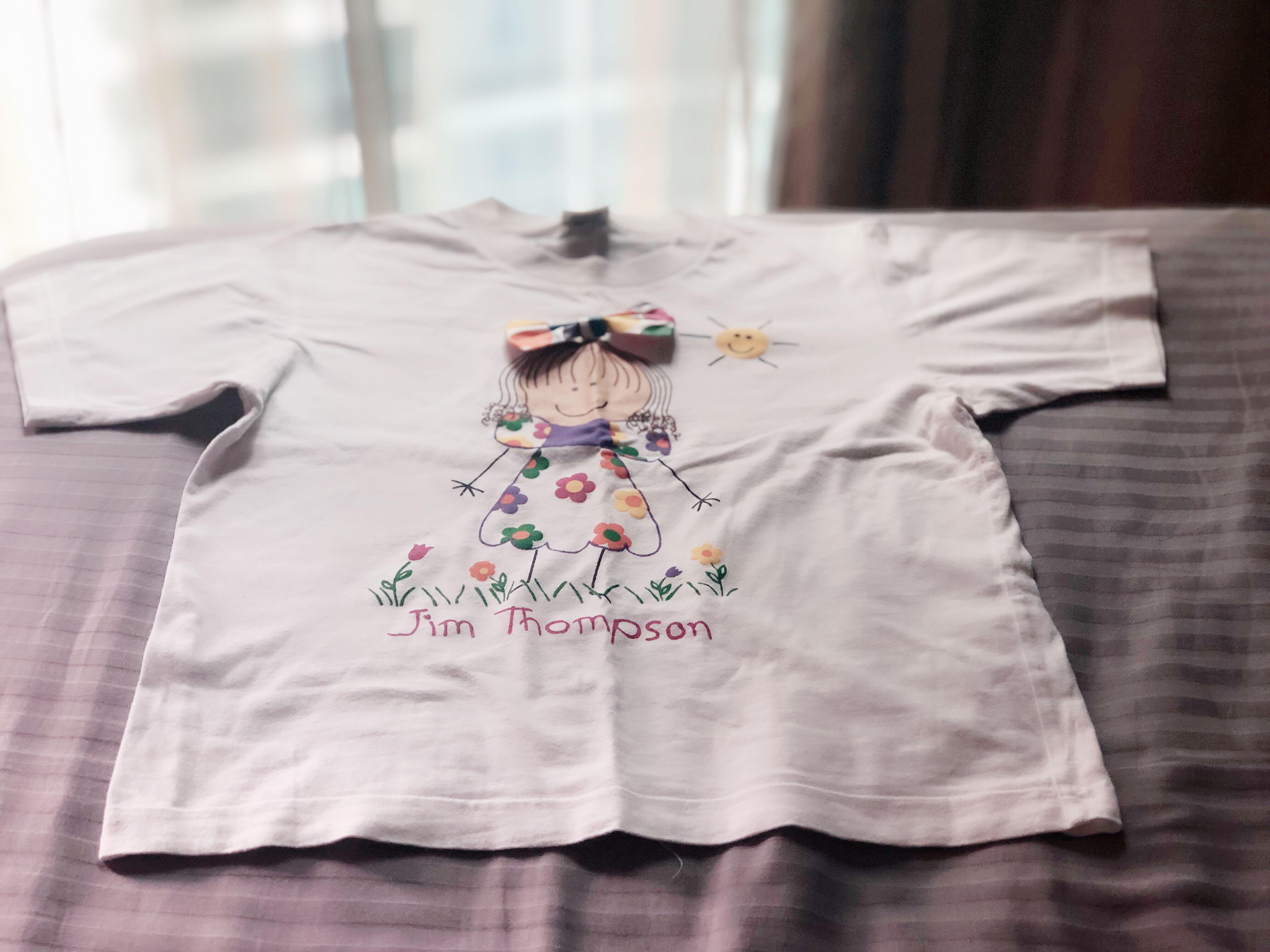 Preloved Jim Thompson Girl T-shirt (pure white) (Category: Babies & Kids Fashion) located in Singapore. Submitted by mozchriz (Listing ID 214339467, Image 2). Description: Genuine Jim Thompson T-shirt Careful owner who only handwashed it. Only worn a few times No stains Ptp 39cm Length 48cm Only meet up at Buangkok MRT station Postage not included yet (normal mail $1.15, smartpac $3.20).