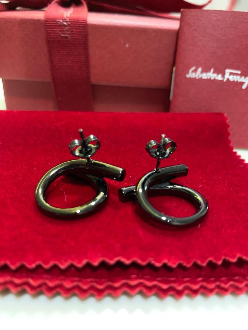 Salvatore Ferragamo Gancio Stud Earrings (Category: Earrings) located in Singapore. Submitted by melodiemelodie (Listing ID 214851034, Image 2). Description: Very unique pair of earrings in black colour. Comes with the following: - Pouch - Box + Ribbon - Care card - Paperbag.