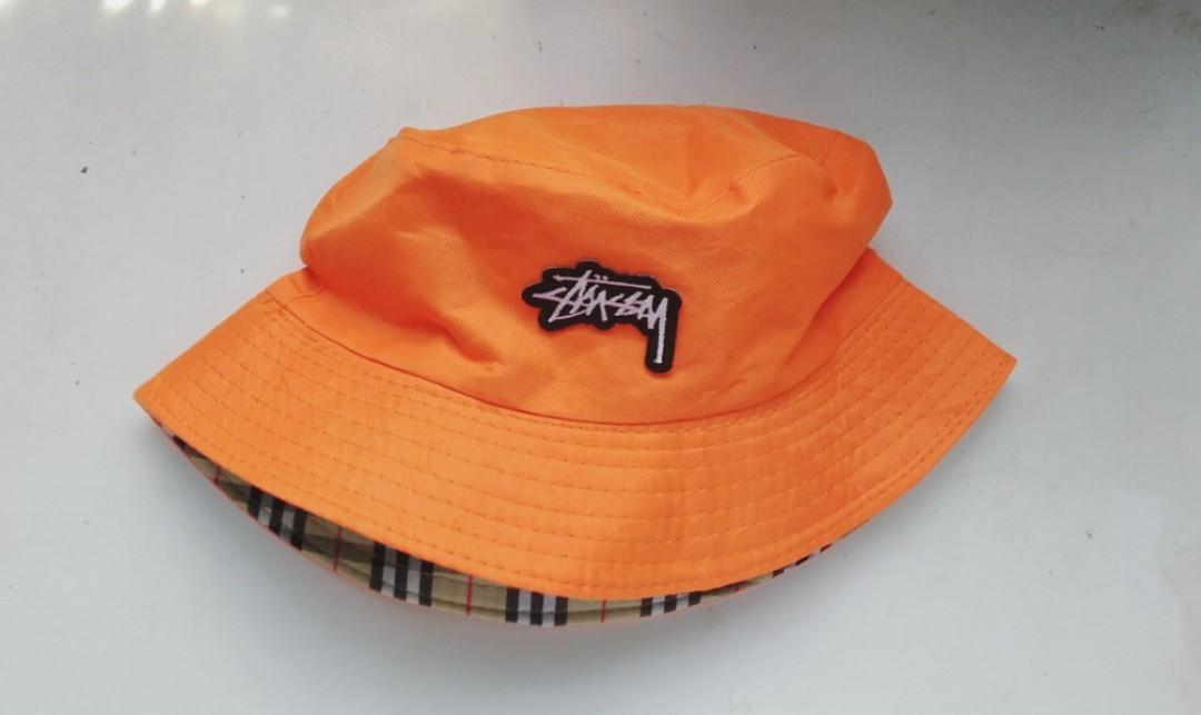 orange stussy bucket hat