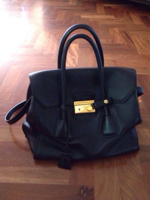 Handbag (Category: Women's Bags & Wallets) located in Bankstown. Submitted by roukya (Listing ID 211453745, Image 1). Description: PRADA bag metal strap damaged on one side & rips inside on both sides ( refer to pictures ^ ).