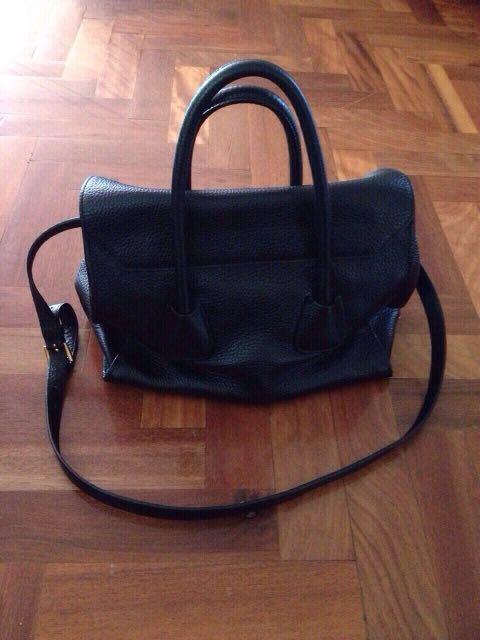 Handbag (Category: Women's Bags & Wallets) located in Bankstown. Submitted by roukya (Listing ID 211453745, Image 2). Description: PRADA bag metal strap damaged on one side & rips inside on both sides ( refer to pictures ^ ).