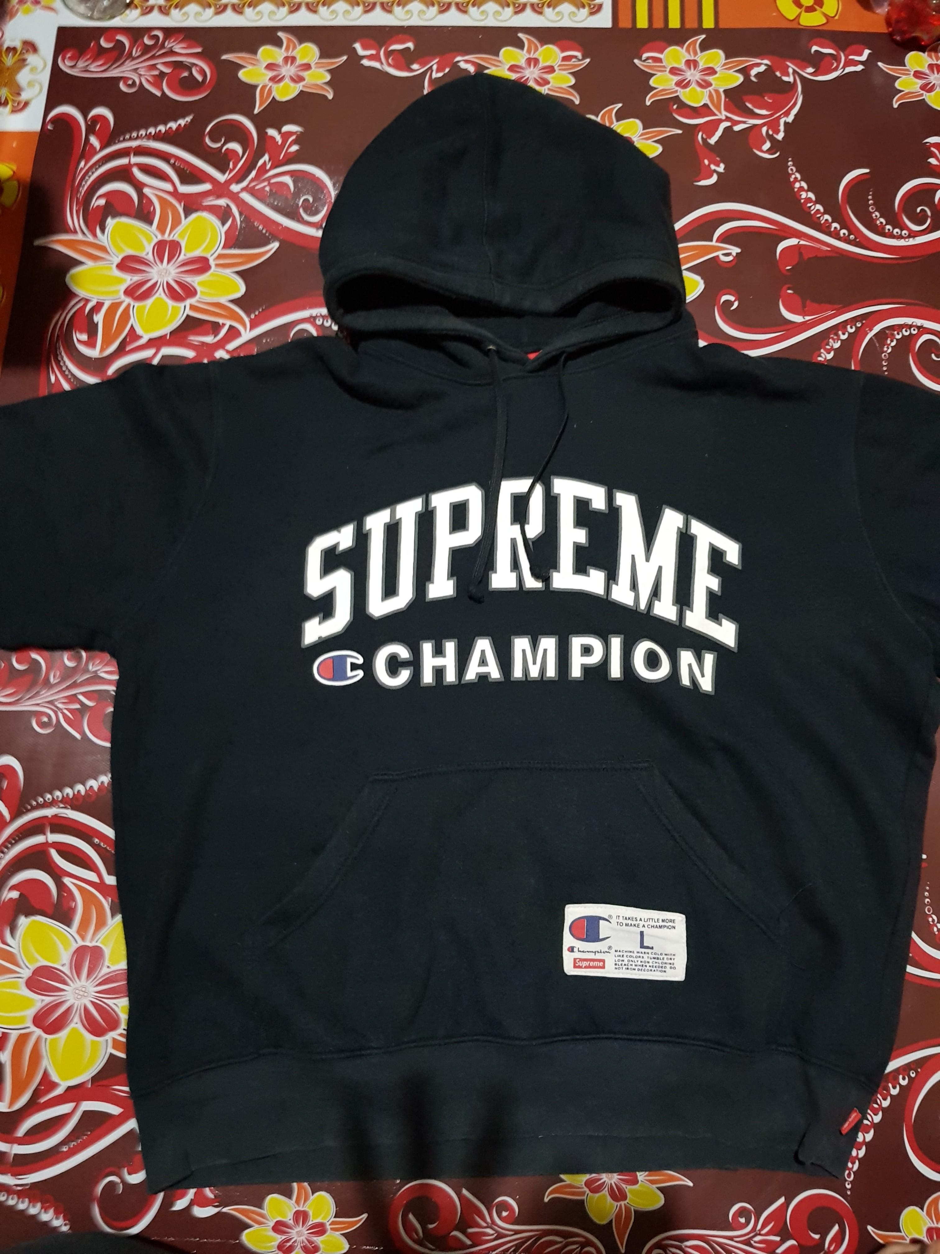 harga hoodie supreme x champion original
