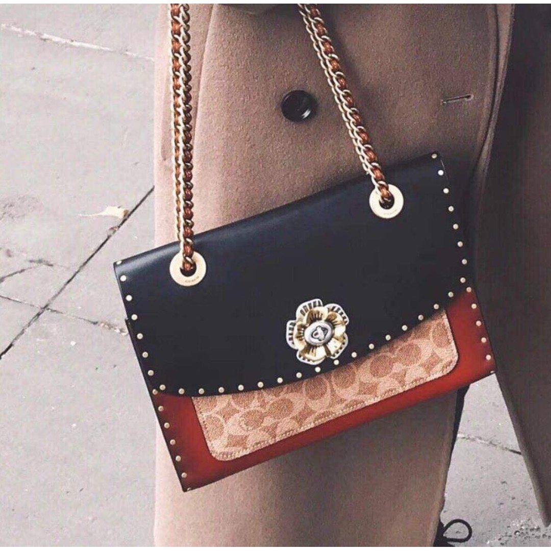 coach parker with rivets and snakeskin detail