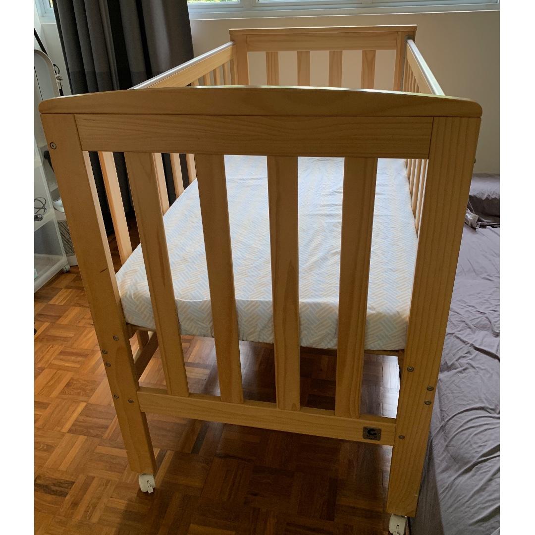 Babycare Solid Timber Cot With Free Fisher Price Bed Mobile