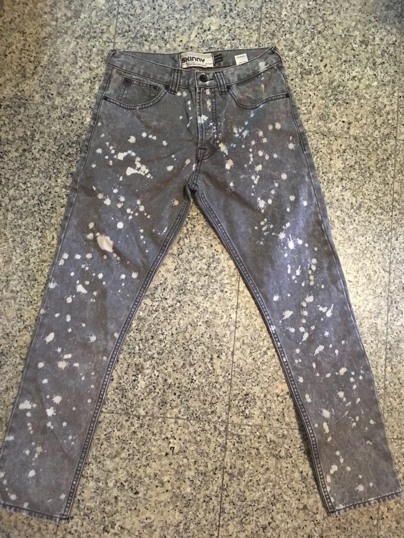 grey jeans with paint splatter