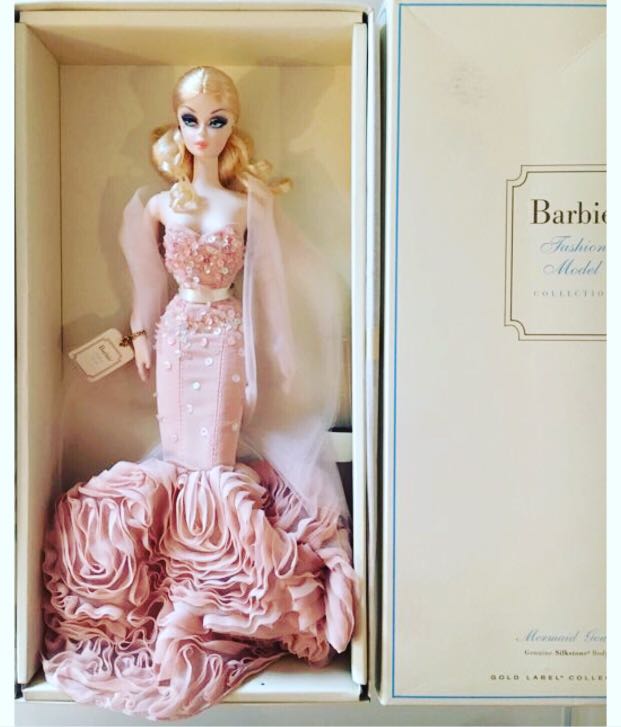Dua Lipa Stuns in Colorful Versace Dress at London Barbie Premiere